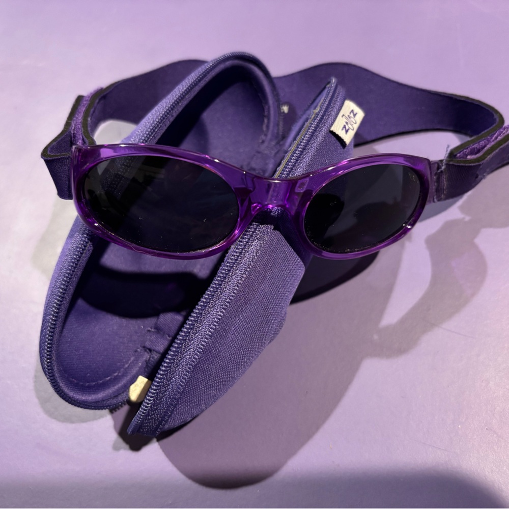 Baby sunglasses. Approx Sz 6-18 months. Velcro is adjustable. Comes with case.